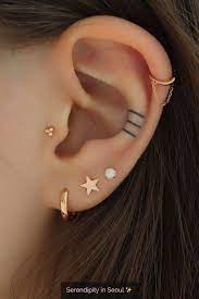 14 Cute And Beautiful Ear Piercing Ideas For Women Biseyre Earings Piercings Cartilage Earrings Stud Star Earrings Stud