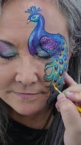 Watching Ronnie Mena paint is mesmerizing 😍 He painted this incredible  peacock at @ArtFactoryStore for #artfactorybodyartfest2024 #bodyart  #facepainting #midlothianva #peacock #linework #blending