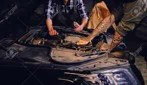 To apply henna correctly, you have to learn to hold the cone first. Close Up Image Of Two Mechanics With Tattoos On Arms Fixing Car S Engine Parts In A Workshop Stock Photo Picture And Royalty Free Image Image 79105332