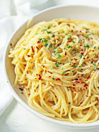 Spaghetti Aglio E Olio Spaghetti Tossed In Sauteed Garlic Olive Oil Red Pepper Flakes Italian Pasta Recipes Italian Recipes Authentic Side Dish Recipes Easy