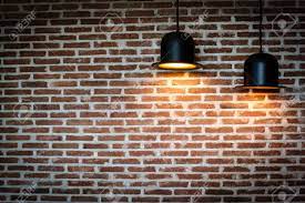 Recolor some of the bricks in the brick background a darker shade of the main color and recolor others a lighter shadows of the main color. Black Lamps Is Shining Orange Light On Red Brick Wall For Background Stock Photo Picture And Royalty Free Image Image 85249062
