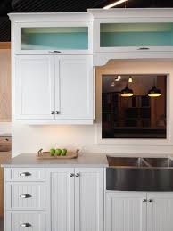 Beach House Inspired Kitchen Display Features Crisp White Beaded Shaker Doors With White Interior Glass Upper Cabinets Beach House Kitchens Kitchen Renovation
