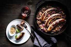 In a deep skillet or dutch oven, add the brats, 1 sliced onion, the beer, and 1/2 of a stick of butter cut into cubes. One Skillet Bratwurst Caramelized Onions Recipe