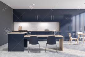 In jennifer's playbook, warm cabinets look best paired with a countertop in the same hue or slightly warmer base color. Interior Of Loft Kitchen With Gray And White Brick Walls Concrete Stock Photo Picture And Royalty Free Image Image 130602894