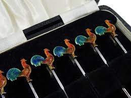 Set of six silver and enamel cockerel cocktail sticks by Adolph Scott