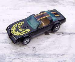Hot Wheels Hot Bird 1977 Black With Yellow And Red Paint Blue Windows Silver Rims Beige Interior Mattel Mad Hot Wheels Hot Wheels Toys Hot Wheels Storage