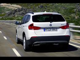 Bmw X1 Rear Angle Speed White 2 Wallpapers Bmw X1 Rear Angle Speed White 2 Stock Photos