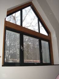 Let Anderson Help You Replace Your Windows With Style Gable Window Attic Flooring Attic Renovation