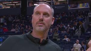 Coach gets hit in head with ball during interview, flashes steely stare