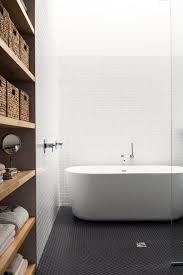 Each circular floor tile shines with a high gloss finish and light grey hue that lights up the room for a sharp, clean look. 45 Trendy Penny Tiles Ideas For Bathrooms Digsdigs