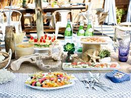 Include a perched pelican, sea shells, beach driftwood and sea creature confetti for a collection of contrasting textures and shapes. How To Host A Beach Themed Backyard Dinner Party Hgtv