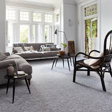 Much As We All Love The Beauty Of Wood The Practicality Of Tiles And The Feel Of Smooth Poured Grey Carpet Living Room Gray Rug Living Room Living Room Carpet