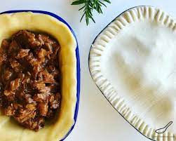 There Are So Many Meat Pie Recipes Around The World And The Aussie Steak Pie Is One Of My Favorites A Beef Meat Pie With Chu Meat Pie Recipe Meat Pie