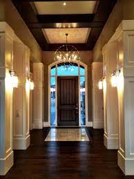 Foyer Wall Sconces And Chandelier Tiled Entry With Hand Scraped Hardwood Walnut Beams And White Paneling Wall Sconces Unique Wall Sconce Wall Sconce Shade
