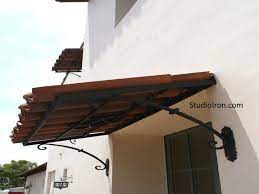 Tiled Roof And Iron Awning Spanish Style Homes Spanish Patio Spanish Style