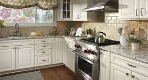 The kitchen island gains a rustic look with its aged paint. Backsplash For Off White Kitchen Cabinets Novocom Top