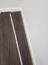 Laminate floors are made up of several materials bonded together under high pressure. How Do I Fix Or Cover This Gap In Between My Floor Boards And My Laminate Flooring Quarter Inch Round Trim Wont Cover It Fixit