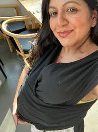 Since the weathers been supppper muggy and hot at night still, what should  I dress my 5 month old in to sleep? She wears a sleep sack with her arms  out always,