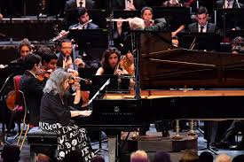 19, and she seems to be having a good time throughout. Prom 34 Argerich West Eastern Divan Orchestra Barenboim Review Erratic Star Sleek Ensemble