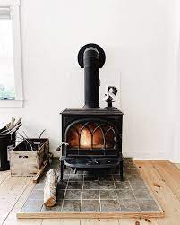 After we ripped the carpet out of our second living area and put in the wood floors i knew that i would want a bit more tile on the floor surrounding the stoves so as not to singe the floor. 25 Home Wood Burning Stove Ideas Digsdigs