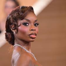 Fashion Faceoff: Iman Vs. Mariah Carey In Donna Karan