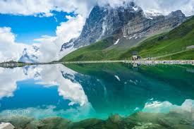 eiger reflected in fallbodensee switzerland summer travel natural landmarks