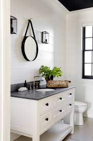 It's warm enough to complement the browns in the vanity countertop. House Tour A Fashion Forward Home That S Surprisingly Kid Friendly Modern Farmhouse Bathroom Farmhouse Bathroom Decor Farmhouse Bathroom Vanity