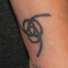 Daisy, flower on her upper back. Pauley Perrette S 14 Tattoos Meanings Steal Her Style