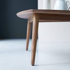 Our wide round coffee table provides an ideal spot to place your books, magazines, or fresh flowers upon with an urban industrial look. Tikamoon Vintage Solid Walnut Coffee Table