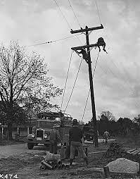 Tva was to improve navigability on the tennessee river, provide for flood control, plan reforestation and the improvement of marginal farm lands, assist in industrial and agricultural development, and aid the national defense in the creation of government nitrate and phosphorus. Men Stringing Rural Tennessee Valley Authority Tva Transmission Lines 1933 Idca