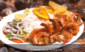 En un sarten con un poco de aceite se frie el ajo y se agregan los camarones. Camarones A La Plancha Cevicheria 7 Mares