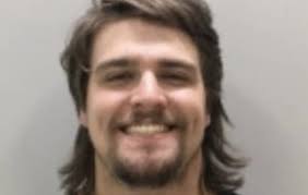 Who smiles like this for a mugshot? New Country sensation Gavin  Adcock...Back