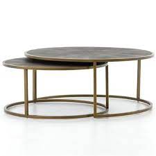 Replace the decor with hardcover books, a plaid runner and candles for a cozy cabin feel. Massey Modern Regency Antique Brass Shagreen Round Nesting Round Coffee Table 31 W 40 W Kathy Kuo Home