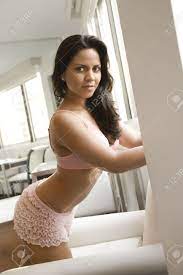 Hispanic Young Adult Woman In Lingerie Leaning On Wall. Stock Photo,  Picture and Royalty Free Image. Image 2189188.