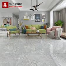 Seamless sliding doors in addition to a set of windows at the top of the ceiling ensure that this living room gets plenty of light. Inspirational Living Room Ideas Living Room Design Gray Floor Tiles Living Room