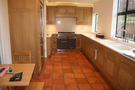 In this picture, we see two different vinyl tiles' styles as there is a combination of light and dark beige and brown tiles. Beautiful Handmade Terracotta Floor Tiles For Sale Based In Kent