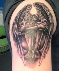 Tiny angel tattoo on back shoulder. 18 Stunning Tribal Angel Tattoos Only Tribal