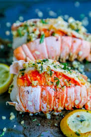 Two Lobster Tails On Baking Sheet With Lemons And Garlic Butter Recipe Picture Lobster Recipes Tail How To Cook Lobster Garlic Recipes