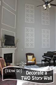 A Little Of This A Little Of That Decorating A Two Story Wall Tall Wall Decor Family Room Walls Foyer Decorating