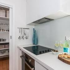 The kitchen backsplash is placed on the kitchen wall between the countertops and the wall cabinets. Corner Cooktop Design Ideas