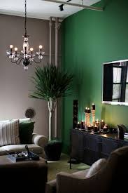 What Color Green Tan Black And Touch Of Brown Emerald Green Living Room Living Room Green Living Room Color Schemes
