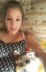 Hello everyone. The shy, very hungry dog has been spotted every evening at  Coral Bay Hotel for several days. We feed her and have noticed that she  wears a yellow/orange plastic band