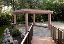 Building a brick retaining wall that is curved is a challenge but the article that follows will explain how it's done. Circular Raised Patio Raises Eyebrows Villa Landscapes