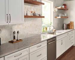 The typical white variety of granite countertop is generally available with gray, black, and even red or blue flecks of stone throughout its surface. 5 Granite Colors That Go Perfectly With White Cabinetry