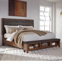 The ruthann upholstered storage platform bed is really solid, and the queen size bed can hold up to a whopping 750 lbs. Signature Design By Ashley Ralene King Upholstered Bed With Bench Storage Footboard Royal Furniture Upholstered Beds