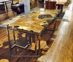 A Modern Dining Table Featuring A Solid Organic Asymmetrical Slab Under A Clear Glass Top In Custom Ma Live Edge Dining Table Unique Dining Tables Dining Table
