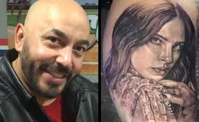 Lupillo rivera fue fotografiado con un tatuaje del rostro de belinda en su brazo izquierdo. F6qgg87rvcalrm