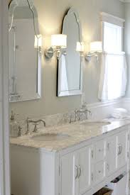 Sinks With Venetian Mirrors And Pretty Sconces Bathroom Sconces Bathroom Sconce Lighting Venetian Mirror Bathroom