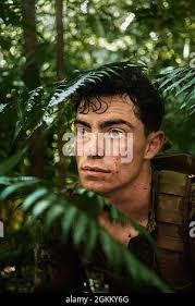 U.S. Marine Corps Cpl. Austin Gibson and Lance Cpl. Silas Weibel, combat  engineers with Special Purpose Marine Air-Ground Task Force-Southern  Command work together to build the base with concrete blocks during the