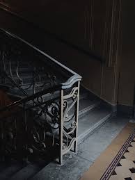 Look at the clean black metal pickets and handrail. Staircase With Black Metal Handrail Free Stock Photo
